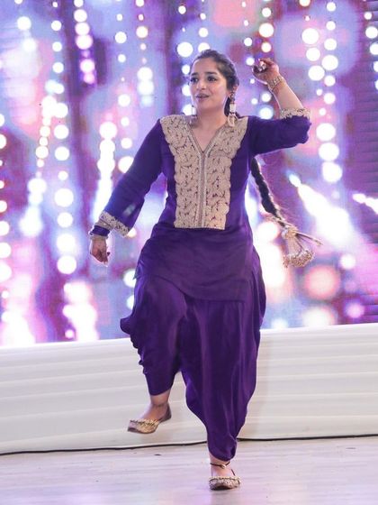 A performer from one of my client's families, dancing with incredible energy and joy.