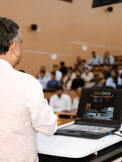 A speaker addressing students in a packed lecture hall during a college fest. My coverage extends beyond the stage to include workshops, talks, and academic events.