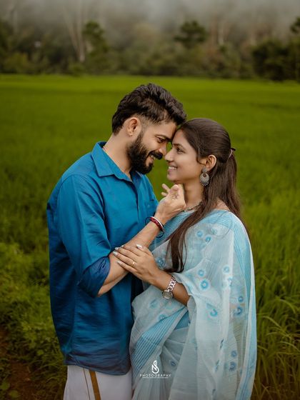 An intimate close-up, capturing the tender moment just before a kiss. The soft lighting and natural setting enhance the romance.