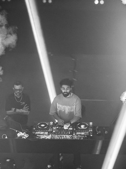 A black and white shot of me on stage, framed by smoke cannons. This captures the epic scale of my productions.