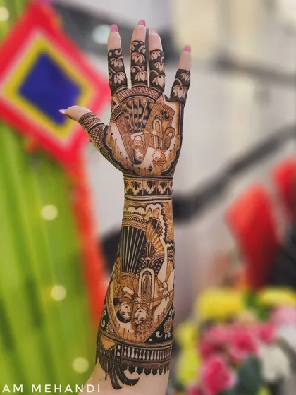 A full bridal arm design with multiple story panels. This piece includes portraits of Radha-Krishna and a doli scene, creating a beautiful narrative from wrist to elbow.