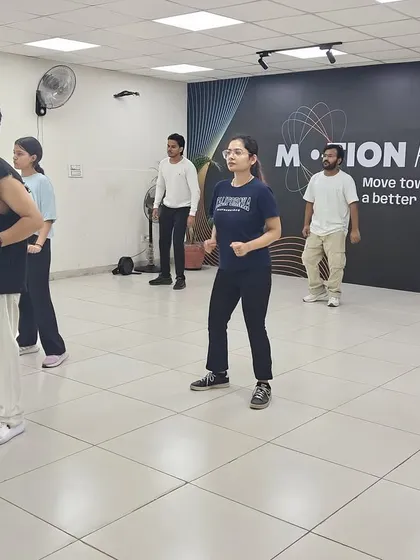 A snapshot of our adult class in action. Everyone is focused, in sync, and learning the choreography together.