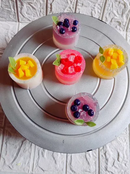 A top-down view of the "Summer Cooler" soaps, showing the different fruit toppings.