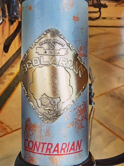 The details make the difference. This is the custom-made brass head badge for the 'Contrarian' bike, a small touch of personality that sets a hand-built bicycle apart from the rest.