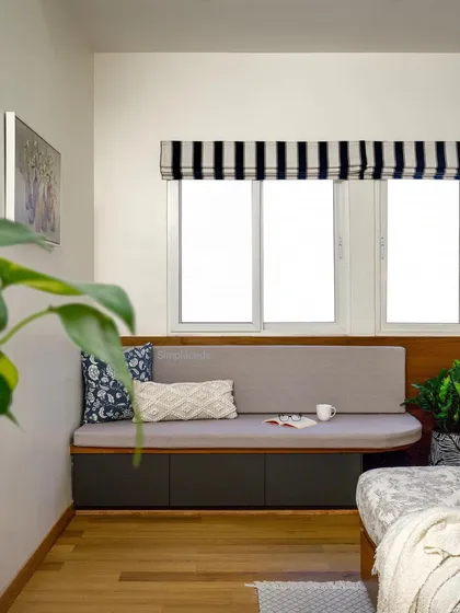 The highlight of this guest room is the cozy window seat with built-in storage drawers. It’s a perfect spot to enjoy the sunshine and a good book.
