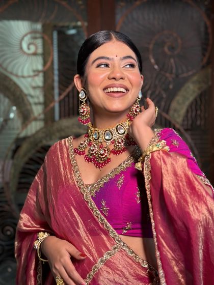 A beautiful candid moment. The soft makeup and sleek hair create a look that is both modern and timeless.