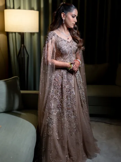 A full view of the Sangeet look, where the high ponytail creates a youthful and modern silhouette, perfect for a night of celebration.