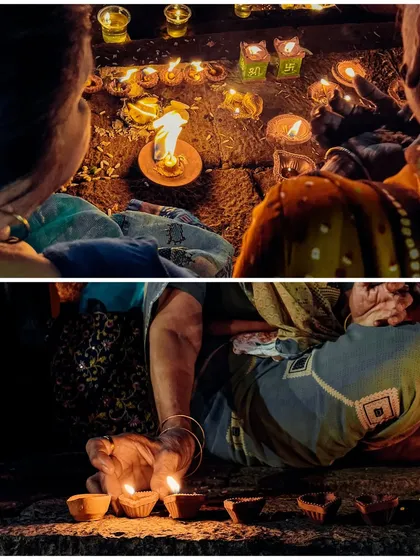 Intimate moments of devotion, as women light their own small diyas along the steps of the Banganga Tank, contributing to the festival of lights.