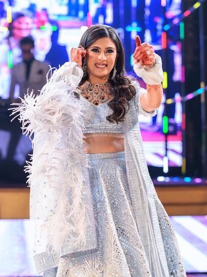 This bride looks like an angel in her stunning blue lehenga with feather details. Her solo performance was absolutely breathtaking.