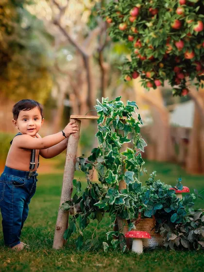 There is something special about golden hour light. This outdoor toddler portrait captures that warm glow and the spirit of childhood adventure in a beautiful orchard setting.