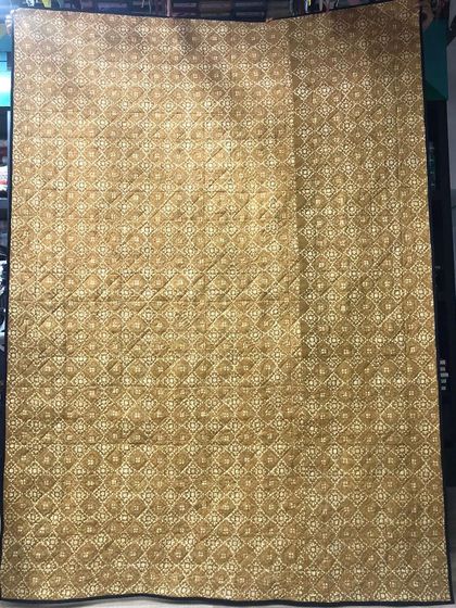 The patterned backing fabric for the Sawtooth Star quilt.