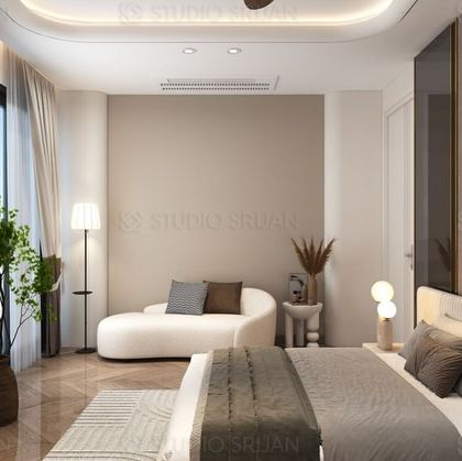 A cozy bedroom retreat featuring a curved chaise lounge by the window. The headboard wall is finished with a textured, neutral-toned fabric, adding warmth and softness to the space.
