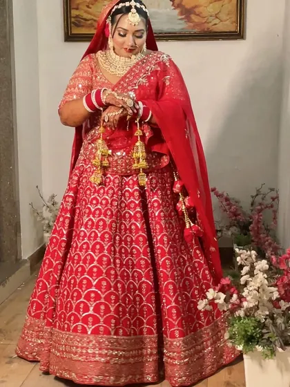 The way she carries her bridal lehenga is pure grace. The makeup is designed to last, letting her enjoy her special moments without any worry.