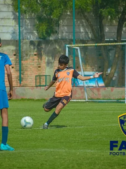 A free-kick situation, showing our player preparing to shoot while the opposition sets up a wall.