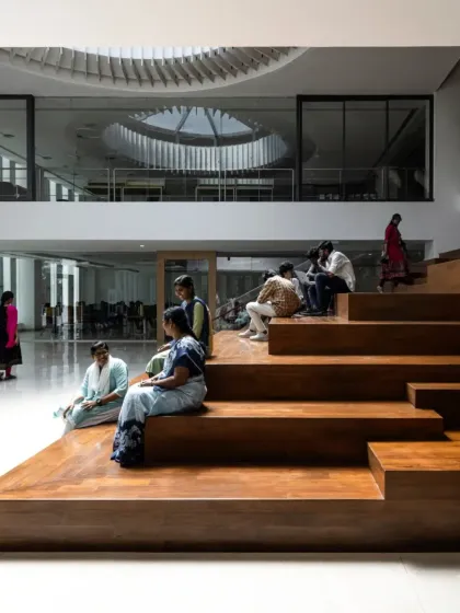 At the Sona University Library, we transformed a simple staircase into a dynamic social hub. This tiered wooden seating area encourages spontaneous interactions and collaborative learning, turning a circulation space into the heart of the campus. It is flooded with natural light from a large circular skylight, creating a warm and inviting atmosphere for students to gather, study, and connect.