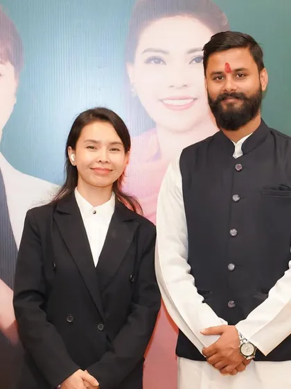 With a fellow yoga professional in Vietnam. Collaborating with international experts is key to fostering a rich, diverse, and unified global yoga community.