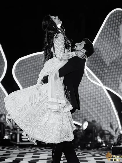 In the heart of the Sangeet, a moment of pure, weightless joy. I believe the best dance floor photos are unscripted, capturing the raw energy and connection between a couple.