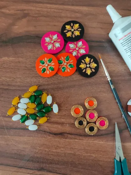 A glimpse of my work-in-progress materials. You can see colorful fabric components, beads, threads, and hand-painted pieces all waiting to be turned into beautiful jewelry.