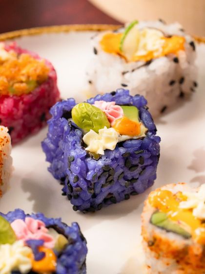 Another beautiful angle of the Blue Rice sushi, highlighting the natural purple hue from the butterfly pea flower.