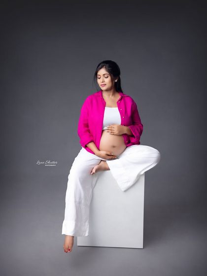 A relaxed, seated pose that feels contemporary and cool. This shows that maternity photos can be fashionable and reflect your personal style.