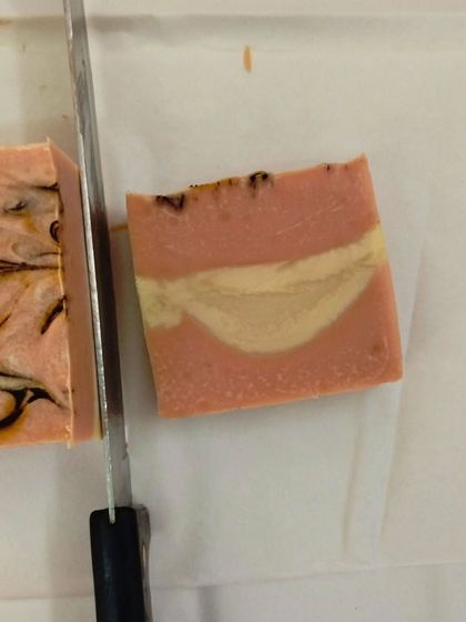 A freshly cut bar of soap, showing the beautiful swirls inside. This is a peek into my January batch making process.