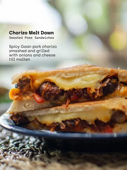 The Chorizo Melt Down from our Poee Sandwich Shop. We smashed and grilled spicy Goan pork chorizo with onions and cheese until molten, creating a perfect bite of comfort.