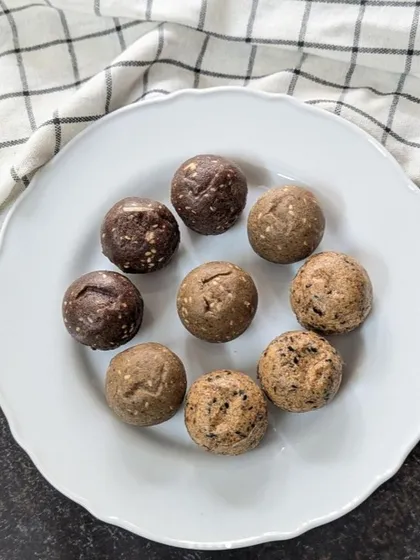 Another look at my assorted millet laddus on a clean white plate, showcasing their natural colors and textures. You can see the difference between the dark Ragi, the lighter Jowar, and the speckled Bajra laddus, each offering a unique taste and health benefit.