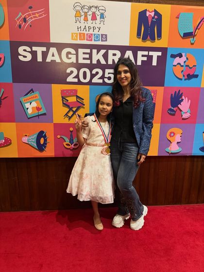 A proud moment with one of our performers, celebrating her achievement with a medal after a fantastic show.