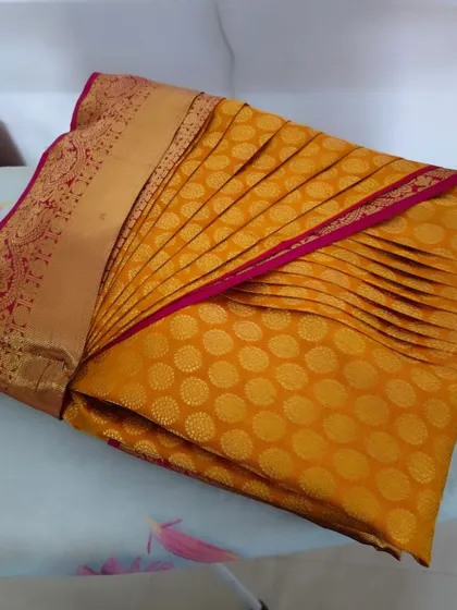 A pre-pleated saree, folded and ready for storage or travel. This is the convenient and elegant solution I provide to my clients.