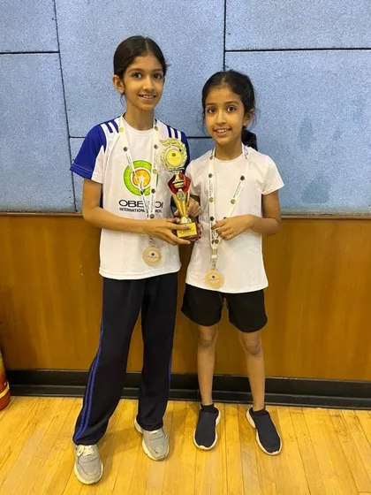 U-12 Girls runners-up Ayra and Shanaya Joshi from Oberoi International School with their trophy and medals.