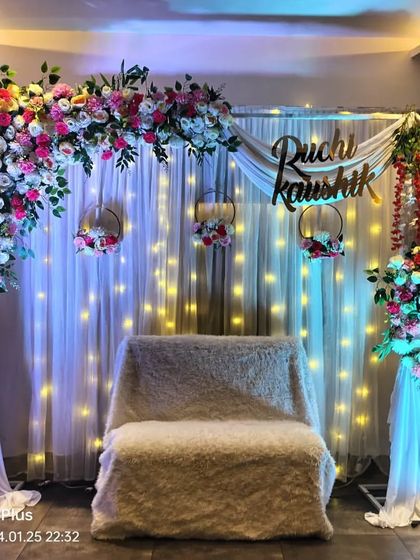 Another angle of the personalized engagement stage, highlighting the draping and floral arrangements. We ensure every detail is perfect for your special day.