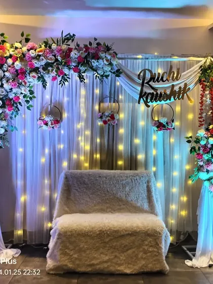 Another angle of the personalized engagement stage, highlighting the draping and floral arrangements. We ensure every detail is perfect for your special day.