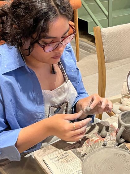 A moment of concentration during a hand-building session at one of our pop-up workshops. It's a chance to escape the noise and enter the clay.