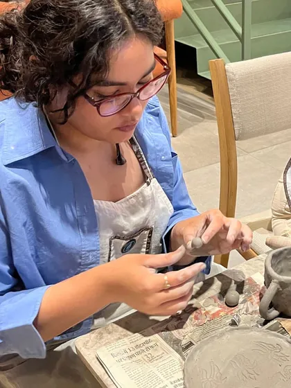 A moment of concentration during a hand-building session at one of our pop-up workshops. It's a chance to escape the noise and enter the clay.