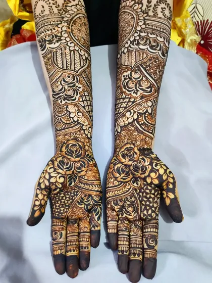 This angle shows the symmetry and balance between the two hands, a critical skill for bridal artists.