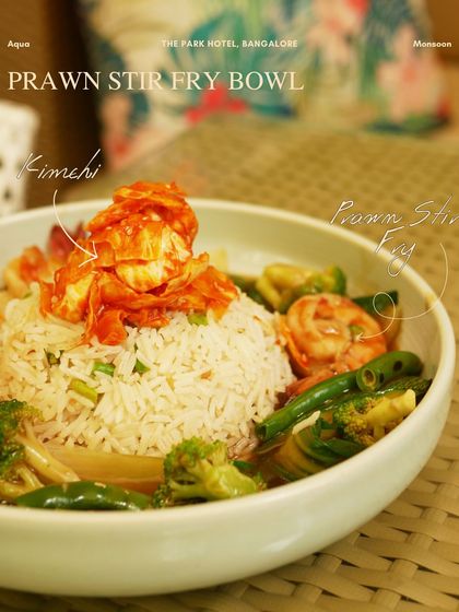 The Prawn Stir Fry Bowl, a satisfying meal with fresh prawns, vegetables, and kimchi, showcasing the Asian influences on our menu.