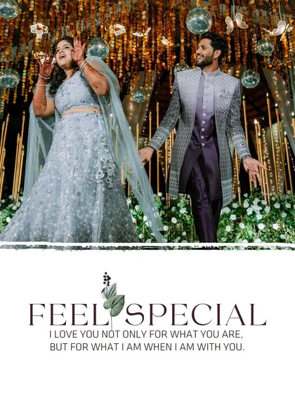 A beautiful shot of the couple on their reception stage, under a cascade of flowers and disco balls, capturing the grand decor.