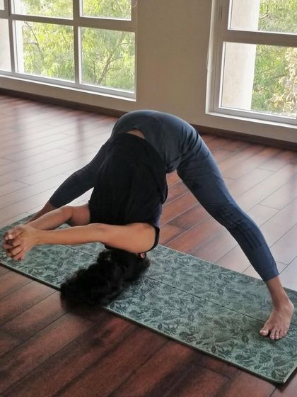 Prasarita Padottanasana (Wide-Legged Forward Bend) is a wonderful inversion that stretches the hamstrings and spine while calming the mind.