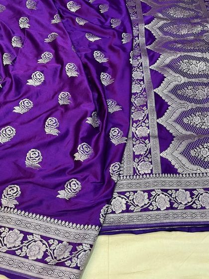 A regal purple Mashru silk saree with woven rose motifs in silver zari.
