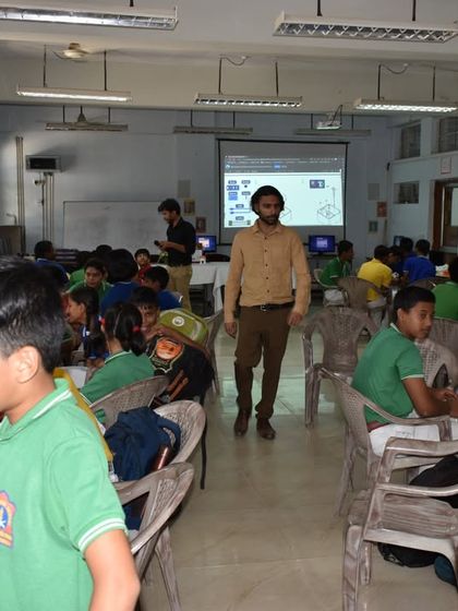 A full classroom of students in Guwahati, each engaged with their computer workstation during a robotics and AI session led by our expert trainers.