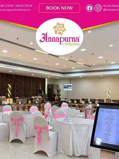 This is a clean and elegant setup at Symphony Banquet, featuring white tables with pink chair sashes. The digital menu kiosk is visible, providing guests with easy access to the day's culinary offerings.