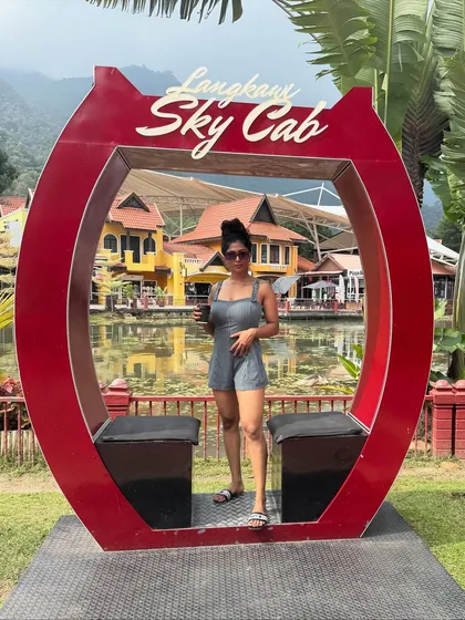 Posing at the Langkawi Sky Cab in Malaysia. My travels are a constant source of inspiration and a reminder to live life to the fullest.