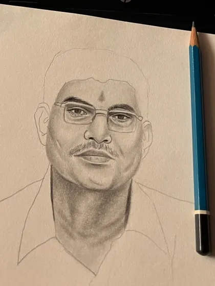 The beginning stages of the portrait, showing the man's face being shaded. This behind-the-scenes look reveals how I build up tone and likeness from a blank page.