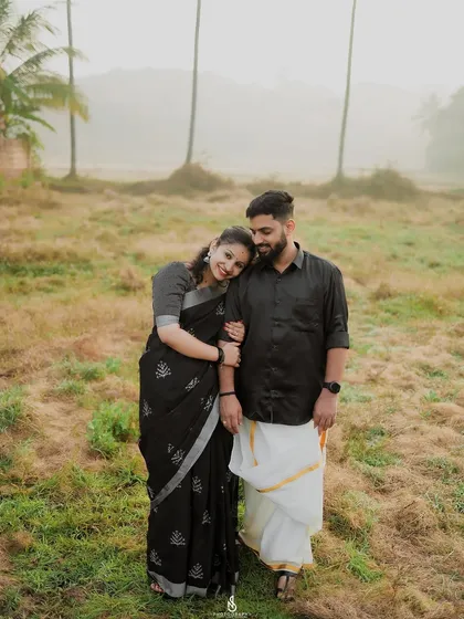 A sweet and simple portrait, with her resting her head on his shoulder. This pose conveys comfort and love.