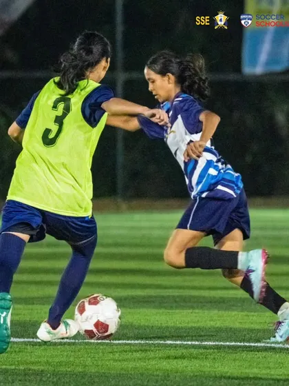 An intense moment of play as Nizh Kapadia shields the ball from a defender. This showcases the physical and technical resilience we build in our players for high-stakes games.