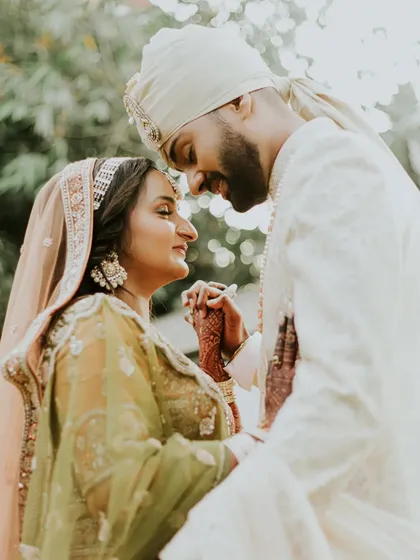 A beautiful close-up of the couple, their faces close together, sharing an intimate gaze. This portrait is all about the connection and emotion you can feel between them.