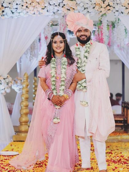 A picture-perfect couple. The groom's makeup and styling are designed to harmonize beautifully with the bride's look, creating a cohesive and stunning pair.