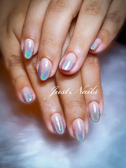 A simple yet stunning holographic ombre effect on natural-length nails.