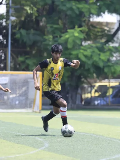 A player dribbling at speed, looking for an opening in the opposition's defense. This shows the confidence and attacking flair of our U-15 squad.