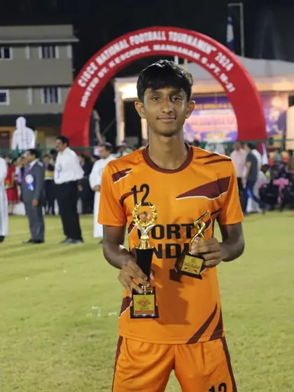 Aadith RP with his Player of the Tournament and team trophies from the CISCE nationals.